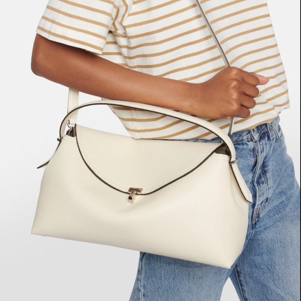 TOTEME T-Lock Top Handle Bag in Pebble Grain Leather Color: Milk